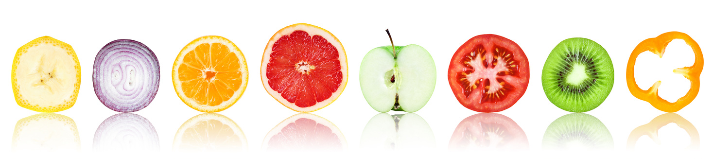 Collection of fresh fruit and vegetable slices on white background